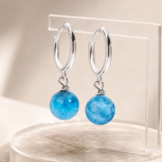 Silver Huggie Hoop Earrings with Blue Marble Bead Charms - Image 2